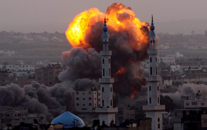 Smoke rises after an Israeli air strike on an allegerd Hamas site in the south east of Gaza City, Gaza Strip, 17 November 2012. Israel has put 75,000 reservists on standby amid speculation of an impending ground invasion. EPA/MOHAMMED SABER