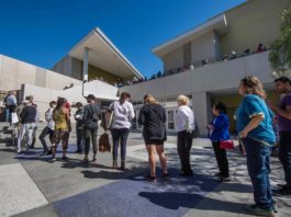 People wait to vote during the presidential primary at the Santa Monica Public Library in Santa Monica, California on Super Tuesday, March 3, 2020 - Fourteen states and American Samoa are holding presidential primary elections, with over 1400 delegates at stake. Americans vote Tuesday in primaries that play a major role in who will challenge Donald Trump for the presidency, a day after key endorsements dramatically boosted Joe Biden's hopes against surging leftist Bernie Sanders. The backing of Biden by three of his ex-rivals marked an unprecedented turn in a fractured, often bitter campaign. (Photo by Mark RALSTON / AFP)