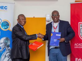 Mr Ambrose Yennah Executive Chairman Of Aidec Left In A Handshake With Professor Fred Mcbagonluri President And Provost Of Acity After The Signing